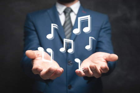 man clicks on virtual screen on musical note symbolsの写真素材