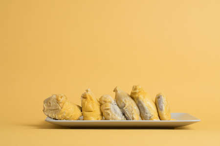 Durian on yellow backgroundの写真素材
