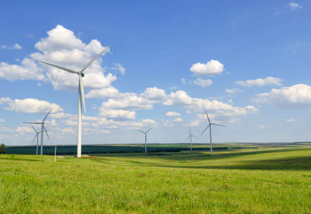 Wind energy, alternative energy. Windmills stand in the field and produce electricityの写真素材