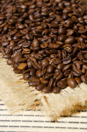 Coffee beans close-up on burlap. Arabica is the most common type of coffee.の写真素材