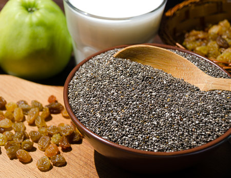 Chia in a bowl, raisins and yogurt. Chia is a plant of the Lamiaceae family, a species of the genus Sage.の写真素材