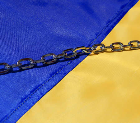 Ukrainian flag. The chain on the flag is Russia's attempt to enslave Ukraine. Ukraine is an...