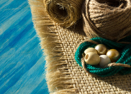 Rope of straw for weaving macrame on a wooden background. Hobby, needlework. weaving macrame.