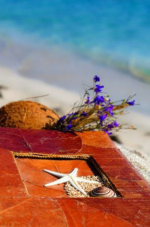 Vintage photo album with a bouquet of wild flowers. Romantic landscape on the ocean.の写真素材