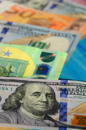 Banknotes of dollars and euros, close-up. Assistance to the Ukrainian people in connection with the invasion of Russian troops.の写真素材