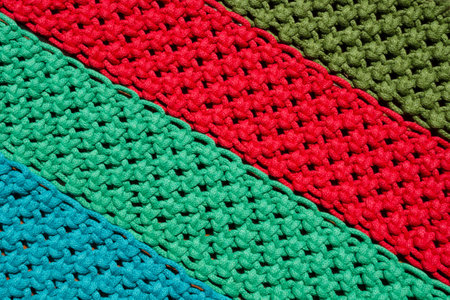 Wicker pattern. Macrame, a square knot of multi-colored threads.