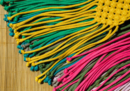 Multi-colored knots on the yarn. Turkish yarn for weaving macrame.の写真素材