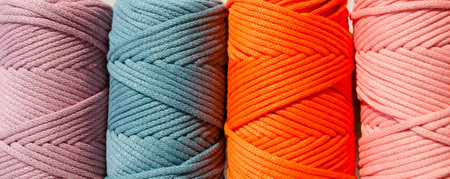 Colored skeins of thread for weaving macrame close-up. Cotton threads of Turkish production.