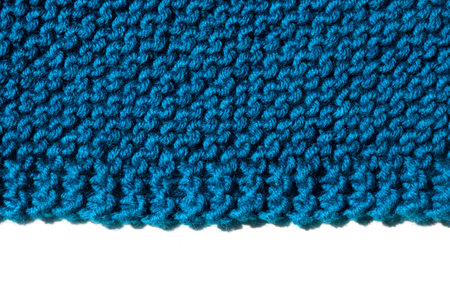 Turquoise textured jersey, knitted on wooden knitting needles from wool blend yarn. The concept of...