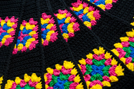 Crochet texture close up. Colorful cotton granny square. Hand knitted zigzag jewelry, a favorite...