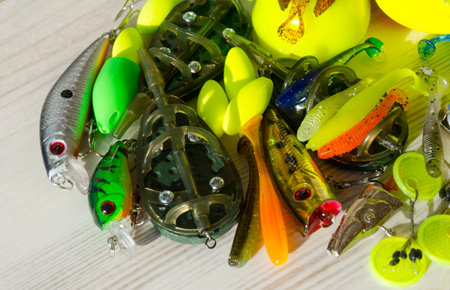 Fishing tackle on a wooden background. Background for a fishing theme.の写真素材