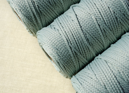 Polyester cord in skins. Mint-colored synthetic cord for knitting bags and baskets.