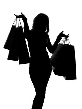 silhouette of a woman with shopping bagsの写真素材