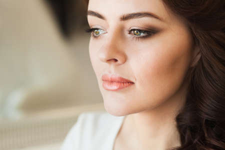 Beautiful young lady with soft make up and bright eyesの写真素材