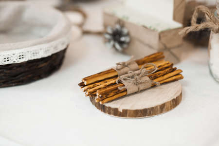 Biscuit straws wired with thread on the tableの写真素材