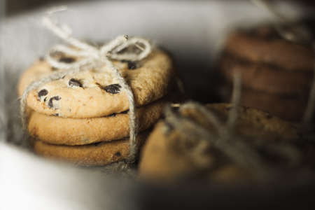 Biscuts with chocolate wired with thread in close-upの写真素材