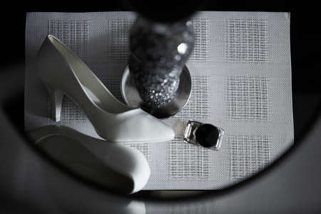 Wedding bride's elements such as shoes and  on the table on the striped backgroundの写真素材