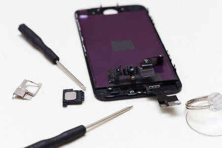 Close-up photos showing process of mobile phone repair, changing the screen.の写真素材