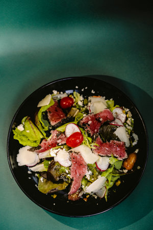 Tuna tataki salad fish food dish on a black plate. Japanese foodの写真素材