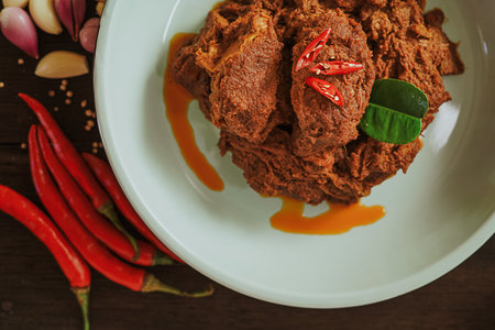 Spicy and tender beef rendang served on a plate with a mix of natural spices. Authentic Indonesian food (3)の写真素材