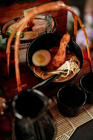 ramen noodle food with chicken and egg mixture in a bowlの写真素材