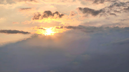 beautiful view of sunset rays in the sky breaking through the clouds in the evening, panoramaの写真素材