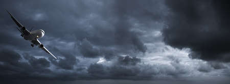 Jet in a dark stormy sky. Panoramic image.の写真素材