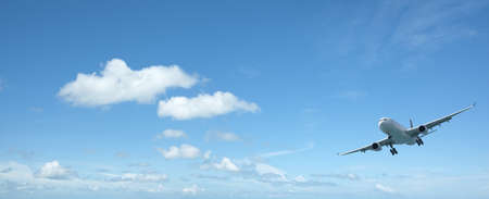 Jet aircraft in a beautiful morning sky. Panoramic composition with a lot of copy space. 