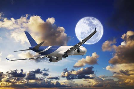 Jet aircraft in a spectacular sunset skyの写真素材