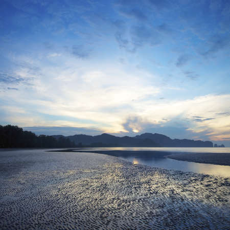 View of a sunrise over Ao Nang beach. Krabi province, Thailand. Square composition.の写真素材