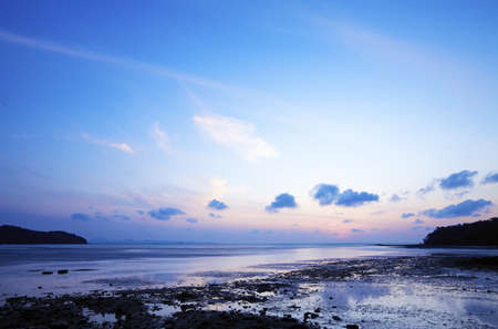 Sunrise over the beach at low tide, Thailand. Long exposure shot.