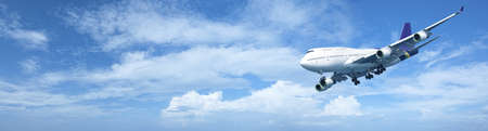 Panoramic composition of a jet plane in a cloudy sky in high resolutionの写真素材
