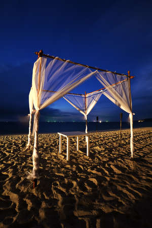 Tropical seaside cafe at night. Long exposure shot.の写真素材