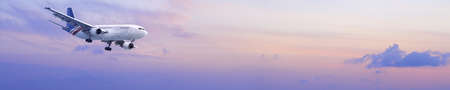 Jet is maneuvering in a morning sky. Panoramic composition.の写真素材