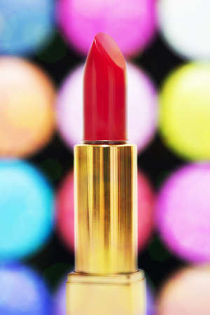 Red lipstick against colorful bokeh. Vertical shot.の写真素材