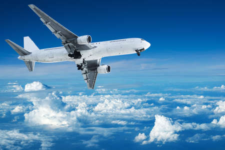 Jet aircraft maneuvering above the clouds