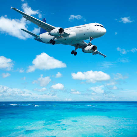 Jet plane over the tropical sea