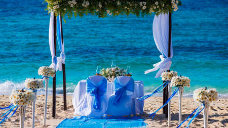  Decorated wedding table on the beach, soft evening lightの写真素材