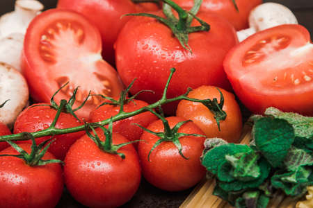 Ingredients, pasta, tomatoes, mushrooms, herbs vegetables and spices Italy wood eat deliciousの写真素材