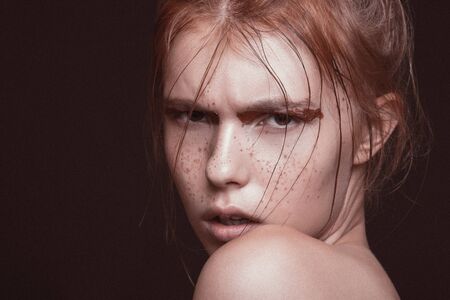 Beauty, woman, female, studio, black background white skin makeup hair hairstyle emotion closeup faceの写真素材