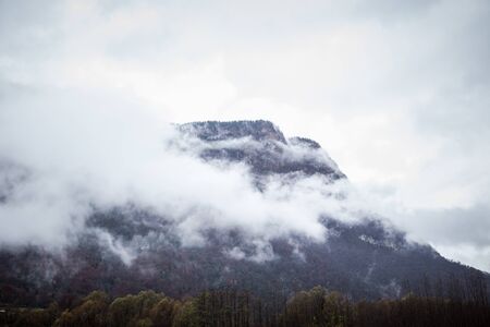 Mountain. Top view in the snow with fog, Italian Alps