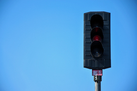 Railroad traffic light on which red lights. Construction of railway tracks. Railway infrastructureの写真素材