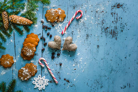 Christmas background with gingerbread, candy cane, hearts and fir tree.の写真素材