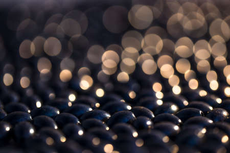 Stylish black background with beads and olives.3d rendering, 3d illustration.
