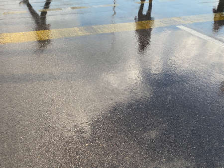 after rain in Izmir city and the reflection of the city on the wet street