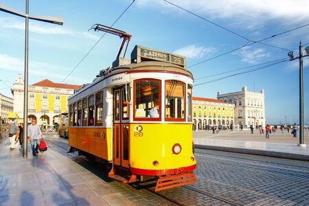 LISBON,PORTUGAL - OCTOBER 12,2012 : Romantic Lisbon street with the typical yellow tram, Lisbon, Portugalのeditorial素材