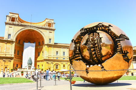 VATICAN CITY, VATICAN - AUG 10, 2011 : The Sphere within a Sphere, a bronze sculpture by Italian sculptor Arnaldo Pomodoro in the courtyard of Vatican Museum in Vaticanのeditorial素材
