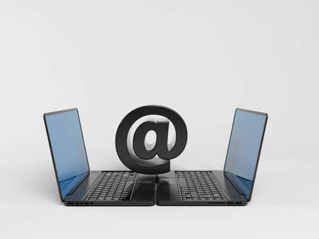 two laptops communicating with at symbol above  in a white 3d stage.の写真素材