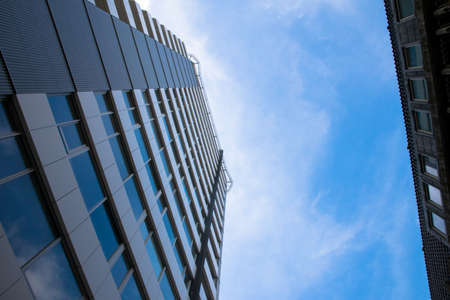 high building with a blue sky backgroundの写真素材