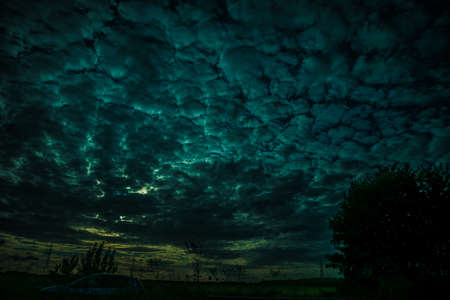 wonderful sunset with natural elements on the road in Europeの写真素材